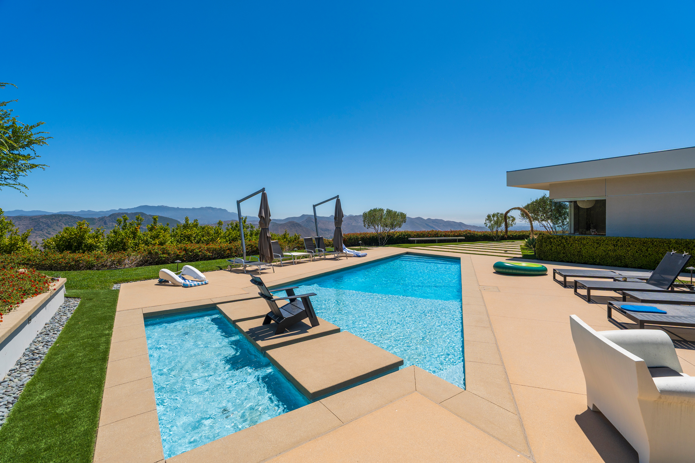 Pool and spa with mountain backdrop